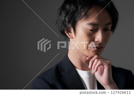 Businessman with thinking expression Businessman with thinking expression 127426611