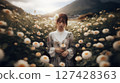 A woman surrounded by flowers 127428363
