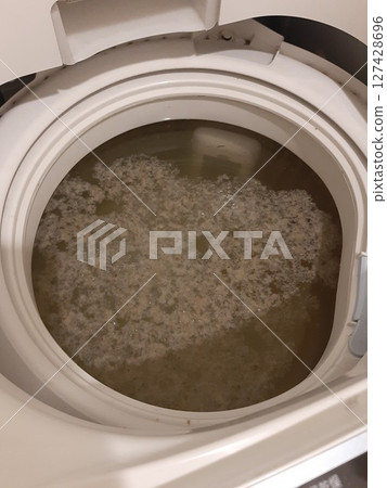 Dirt in the washing machine drum Cleaning a dirty washing machine drum Dirt in the washing machine drum Cleaning a dirty washing machine drum 127428696