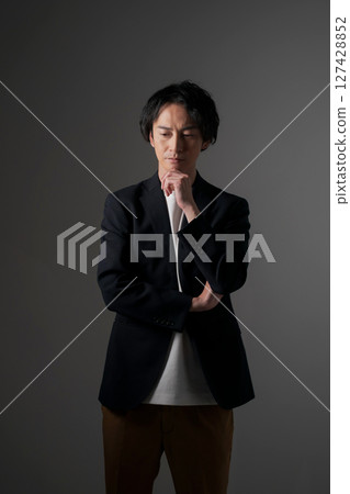 Businessman with thinking expression Businessman with thinking expression 127428852