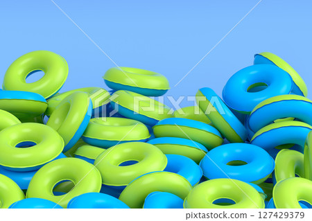Pile of inflatable ring for swimming pool isolated on blue background Pile of inflatable ring for swimming pool isolated on blue background 127429379