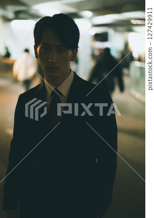Young male business person at night 127429911