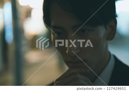 Young male business person at night 127429931