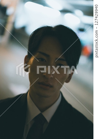 Young male business person at night 127429940