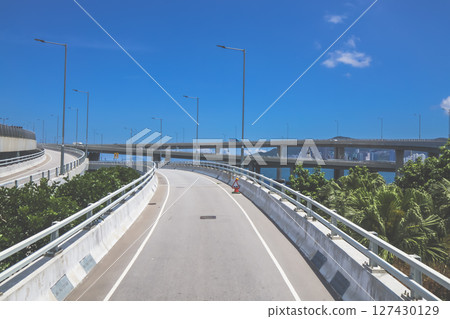June 7 2025 Empty Elevated Road With Clear Blue Sky in Urban Setting 127430129
