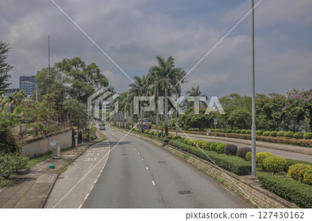 June 7 2025 Elevated Road With Curve and Scenic Urban and Natural Background 127430162