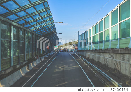 June 7 2025 Urban Roadway Curve Under Modern Overpasses With Daylight Shadows June 7 2025 Urban Roadway Curve Under Modern Overpasses With Daylight Shadows 127430184
