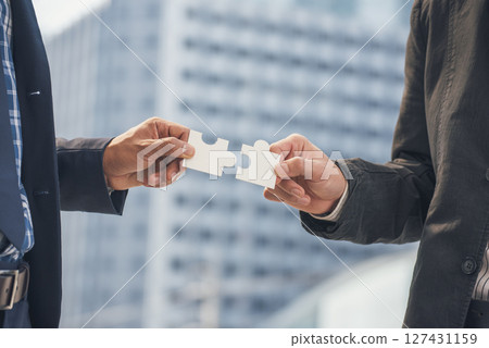 Unified synergy assembly business game implementation multiple puzzle meeting. Business connections strategy synergy team solution. Piece of jigsaw assembly by implement multiple game puzzle. Hands of Unified synergy assembly business game implementation multiple puzzle meeting. Business connections strategy synergy team solution. Piece of jigsaw assembly by implement multiple game puzzle. Hands of 127431159