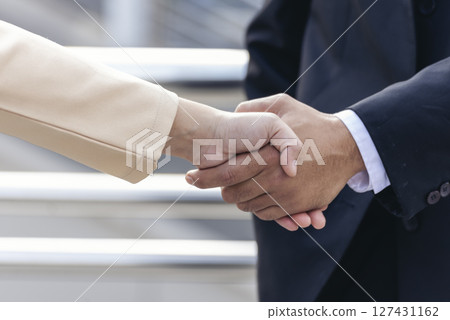 Trust honesty business customer handshake together promise respect partner. Businessman diversity solidarity team multiethnic Partner hands together teamwork. Multiracial meeting shaking hands concept 127431162