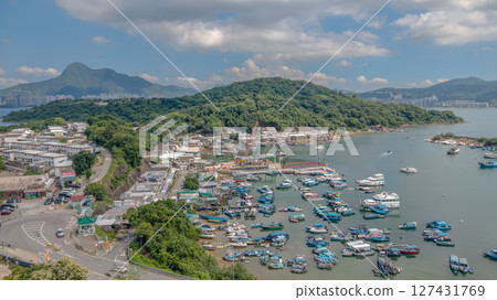 June 7 2025 Harbor View with Boats Docked and Mountainous Background Under Blue Sky 127431769