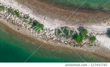 View of a Scenic Peninsula with Greenery and Clear Blue Waters 127431787