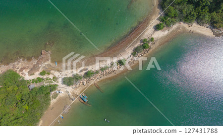 View of a Scenic Peninsula with Greenery and Clear Blue Waters 127431788