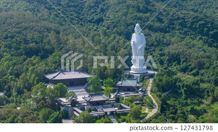 June 7 2025 Large Buddhist Statue Amidst Greenery and Temple Complex 127431798