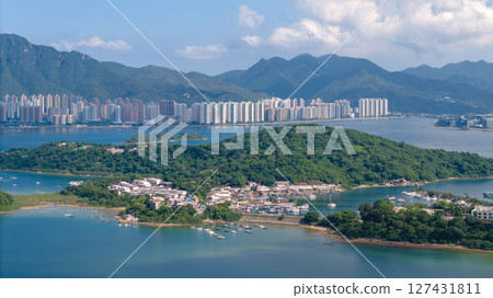 June 7 2025 Scenic Coastal View with Lush Greenery and Urban Buildings June 7 2025 Scenic Coastal View with Lush Greenery and Urban Buildings 127431811