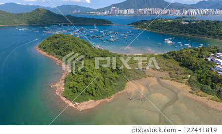 View of Coastline with Boats and Greenery in Crystal Clear Water View of Coastline with Boats and Greenery in Crystal Clear Water 127431819