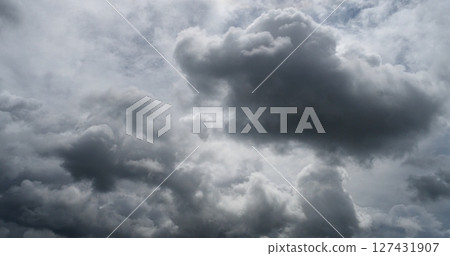 Dark rain cloud dramatic sky summer tropical thunder storm sky and fluffy black darkness cloud nearly raining cloudscape. Nimbus raincloud skyline climate background. Dark gray sky cloudy environment Dark rain cloud dramatic sky summer tropical thunder storm sky and fluffy black darkness cloud nearly raining cloudscape. Nimbus raincloud skyline climate background. Dark gray sky cloudy environment 127431907