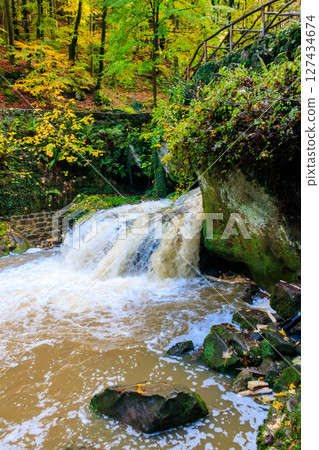 Schiessentumpel waterfall in the Mullerthal, Luxembourg in autumn 127434674