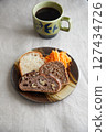 A healthy breakfast of three kinds of bread and carrot rapée 127434726