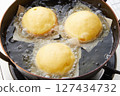 Inside a pan frying donuts 127434732