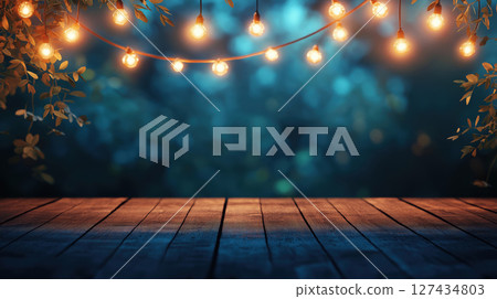 Wooden terrace illuminated by warm string lights with leafy decorations against a dark blurred evening background. Cozy outdoor setting. Night ambience. 127434803