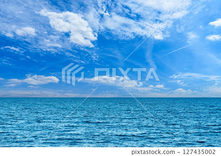 Vibrant Ocean Vista Azure Waters Meet a Sky Canvas of Clouds and Endless Horizon Vibrant Ocean Vista Azure Waters Meet a Sky Canvas of Clouds and Endless Horizon 127435002