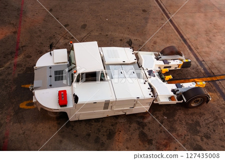Aircraft Towing Tractor Ready on Airport Apron for Operation, Ground Support Equipment 127435008