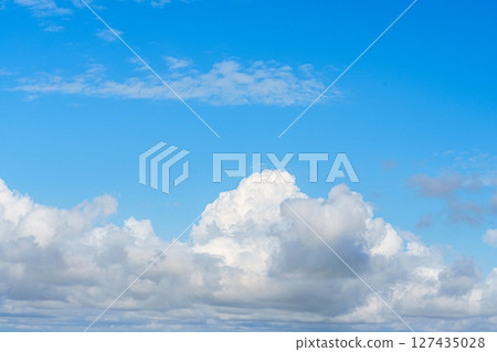 Picturesque Blue Sky with Fluffy Clouds, Ideal for Serene Backgrounds and Creative Projects Picturesque Blue Sky with Fluffy Clouds, Ideal for Serene Backgrounds and Creative Projects 127435028
