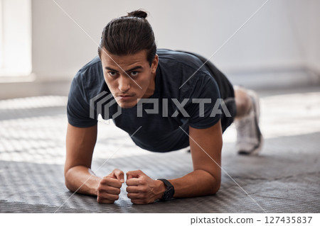 Plank exercise, ab workout and man with gym fitness training routine for body wellness, building muscle and balance. Personal trainer, athlete working out and planking exercising for health wellbeing Plank exercise, ab workout and man with gym fitness training routine for body wellness, building muscle and balance. Personal trainer, athlete working out and planking exercising for health wellbeing 127435837