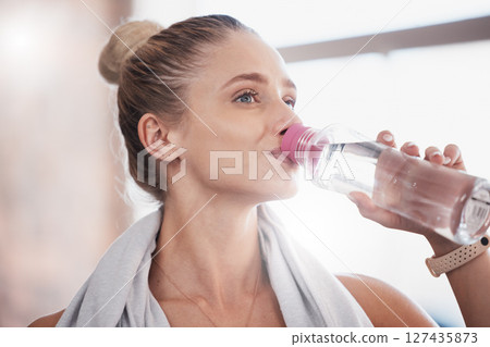 Fitness, workout and exercise woman drinking water bottle for hydration break on cardio run in nature. Training, running and healthy lifestyle of athlete girl with drink for health, hydrate and sport 127435873