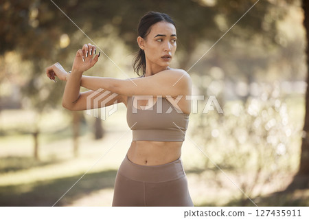 Arms stretching, fitness and woman outdoor in a park for exercise, wellness and sport workout. Runner health, sports and training of a athlete in nature ready for running and morning activity Arms stretching, fitness and woman outdoor in a park for exercise, wellness and sport workout. Runner health, sports and training of a athlete in nature ready for running and morning activity 127435911