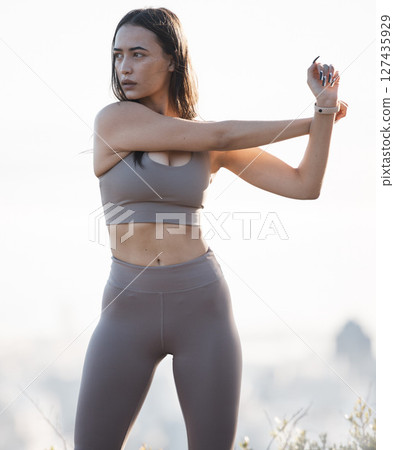 Fitness, nature and woman stretching in running training, cardio exercise or outdoor workout in peace. Focus, morning and healthy sports girl runner ready to start activity or exercising a slim body 127435929