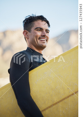 Happy surfer, man carrying surfboard and board for surfing sport on ocean waves for fitness workout, summer wellness surf and water training exercise. Beach freedom, sea wetsuit and surf in Australia 127435943