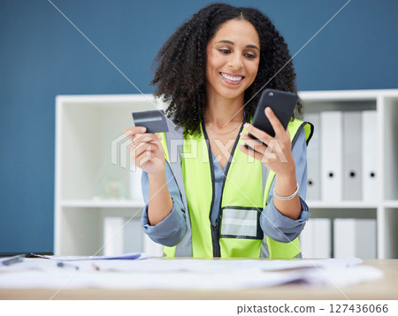 Credit card, phone and construction worker woman with online shopping app for logistics, supplier or hardware stock market. Mobile app, architecture and engineer on smartphone for e commerce website Credit card, phone and construction worker woman with online shopping app for logistics, supplier or hardware stock market. Mobile app, architecture and engineer on smartphone for e commerce website 127436066