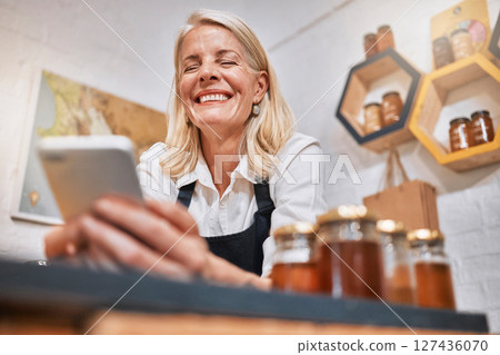 Phone, sales and success with woman in store for honey, supermarket and natural grocery. Organic, health and wellness with small business owner and profit for retail, nutrition and vitamin products Phone, sales and success with woman in store for honey, supermarket and natural grocery. Organic, health and wellness with small business owner and profit for retail, nutrition and vitamin products 127436070