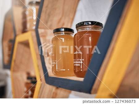 Honey glass container, shop product and retail food sale with modern store packaging and stock. Vegan, sustainable and eco friendly grocery products on discount in a supermarket business or market Honey glass container, shop product and retail food sale with modern store packaging and stock. Vegan, sustainable and eco friendly grocery products on discount in a supermarket business or market 127436073