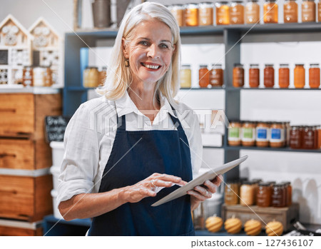 Success, tablet and woman manager of a small business, honey store or retail shop searching online. Smile, portrait and happy entrepreneur scrolling the internet for digital marketing advice or tips Success, tablet and woman manager of a small business, honey store or retail shop searching online. Smile, portrait and happy entrepreneur scrolling the internet for digital marketing advice or tips 127436107