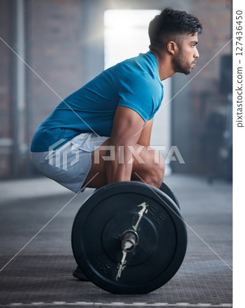 Fitness, deadlift and man in gym in a workout, exercise or strength training for strong powerful legs and core. Focus, wellness and healthy Indian sports bodybuilder weightlifting a heavy barbell Fitness, deadlift and man in gym in a workout, exercise or strength training for strong powerful legs and core. Focus, wellness and healthy Indian sports bodybuilder weightlifting a heavy barbell 127436450