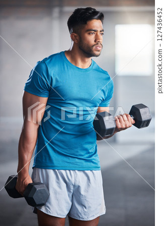 Bodybuilder man, workout and weightlifting with dumbbell in gym for healthy body, fitness and muscle. Athlete, training and exercise with metal weight for health, wellness and physical development 127436452