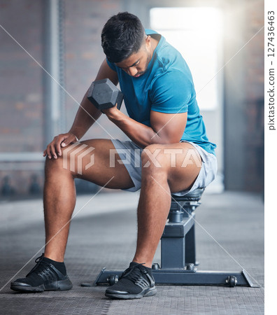 Dumbbells, gym and man fitness training as a healthy bodybuilder for strong biceps or powerful arm muscles. Workout, exercise and sports athlete weight lifting heavy weights for strength in Dubai 127436463