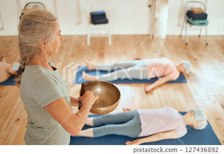 Sound bowl, women healing and healer with senior class for music therapy meditation, alternative medicine or audio holistic healthcare. Yoga, chakra and reiki energy support for relax people on floor Sound bowl, women healing and healer with senior class for music therapy meditation, alternative medicine or audio holistic healthcare. Yoga, chakra and reiki energy support for relax people on floor 127436892