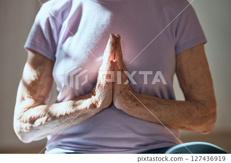 Elderly woman, yoga prayer and meditation in retirement for spiritual health healing, faith in religion and wellness support. Senior, zen energy and mindfulness exercise to relax and detox the mind Elderly woman, yoga prayer and meditation in retirement for spiritual health healing, faith in religion and wellness support. Senior, zen energy and mindfulness exercise to relax and detox the mind 127436919