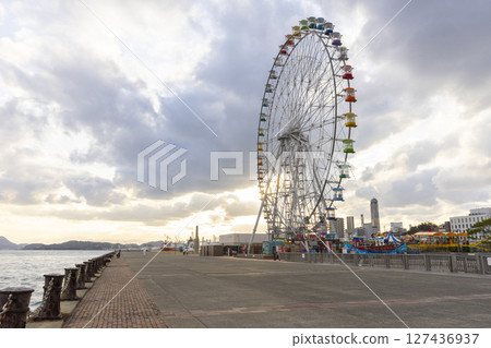 Shimonoseki, JAPAN - Dec 29,2022 : Ferris wheel at Haikara't Yokocho (Haikara Yokocho) in Shimonoseki, Japan on Dec 29,2022. 127436937