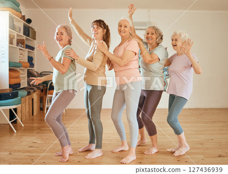 Elderly, yoga and portrait of friends row dance together on class break for cheerful fun. Retirement, wellness and senior friendship in yoga class with happy, healthy and fitness women. Elderly, yoga and portrait of friends row dance together on class break for cheerful fun. Retirement, wellness and senior friendship in yoga class with happy, healthy and fitness women. 127436939