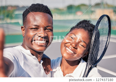 Sports, tennis and selfie portrait of black couple enjoying summer day playing game, match and training together. Fitness, exercise and face of man and woman on outdoor tennis court with racket Sports, tennis and selfie portrait of black couple enjoying summer day playing game, match and training together. Fitness, exercise and face of man and woman on outdoor tennis court with racket 127437180