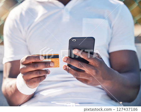 Black man, hands and phone with credit card for online banking, ecommerce or remote transaction. Hand of shopper using mobile smartphone and card for banking app, digital payment or wireless purchase 127437186