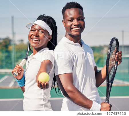 Tennis, fitness and portrait of couple with smile standing on court in summer for friendly match. Sports exercise, happy friendship and teamwork, healthy black woman and young man at fun doubles game Tennis, fitness and portrait of couple with smile standing on court in summer for friendly match. Sports exercise, happy friendship and teamwork, healthy black woman and young man at fun doubles game 127437210