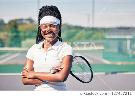 Tennis, athlete and portrait of black woman on a court with a racket before training or match. Sports, fitness and happy African lady with smile standing on outdoor tennis court for game or workout. 127437211