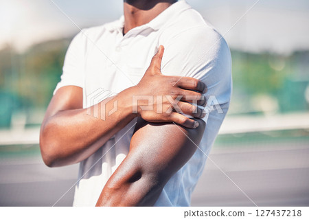 Black man, hand and arm pain from healthcare accident or medical wellness emergency outdoor. African person, shoulder injury and broken bone, hurt muscle or arthritis during fitness workout on court 127437218