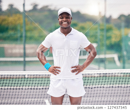 Fitness, tennis and portrait of a black man on the court ready for outdoor training or a match. Sports, tournament and young African athlete standing on a tennis court for a game, workout or exercise 127437345