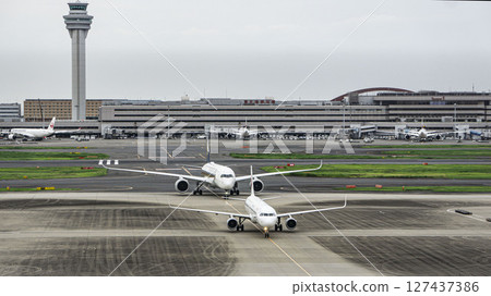 Haneda Airport, two aircraft and terminal Haneda Airport, two aircraft and terminal 127437386